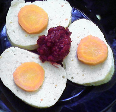 Gefilte fish, served with horseradish and carrot (Wikipedia.org)