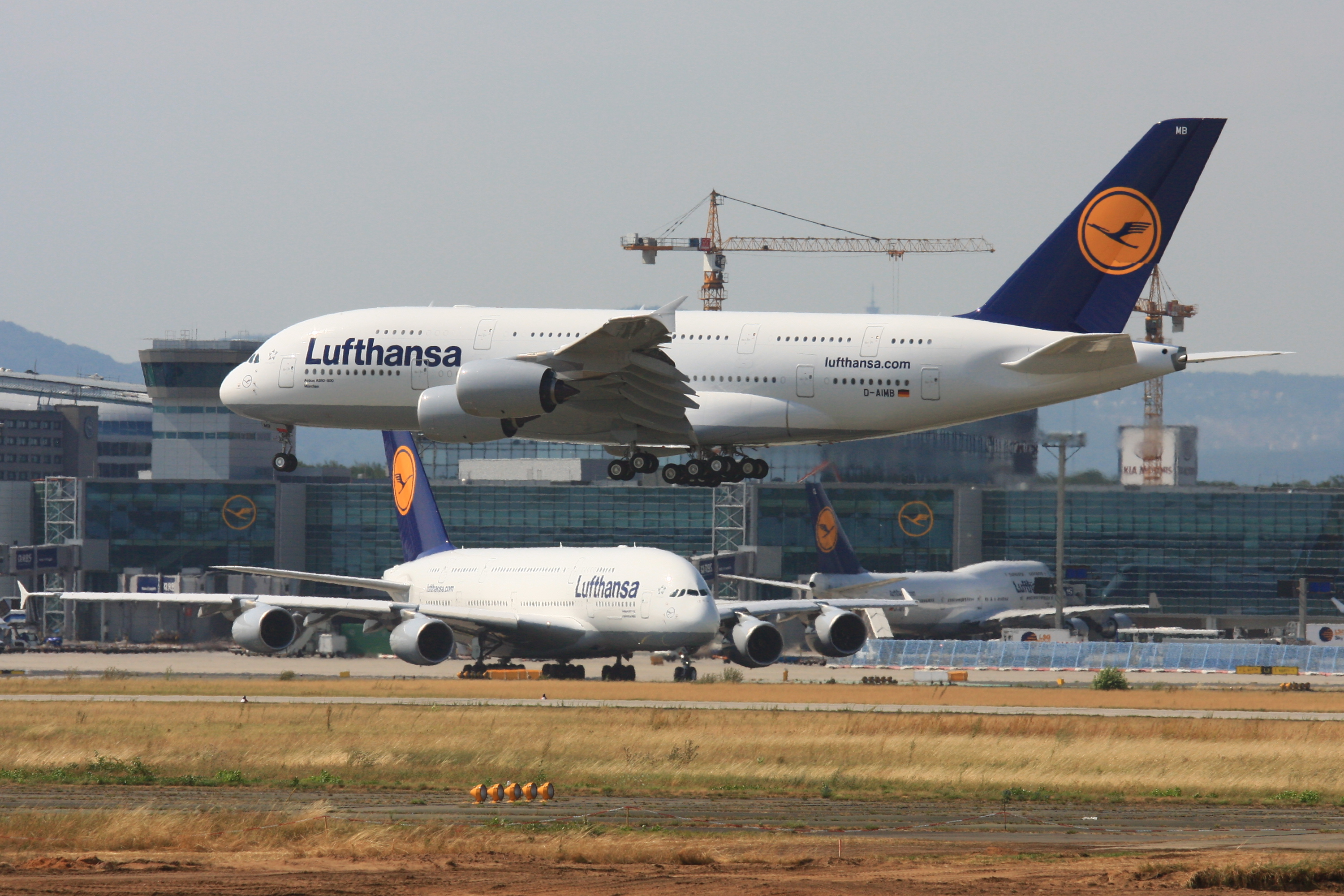 Two Airbus A380 and a Boeing 747 aircraft at F...