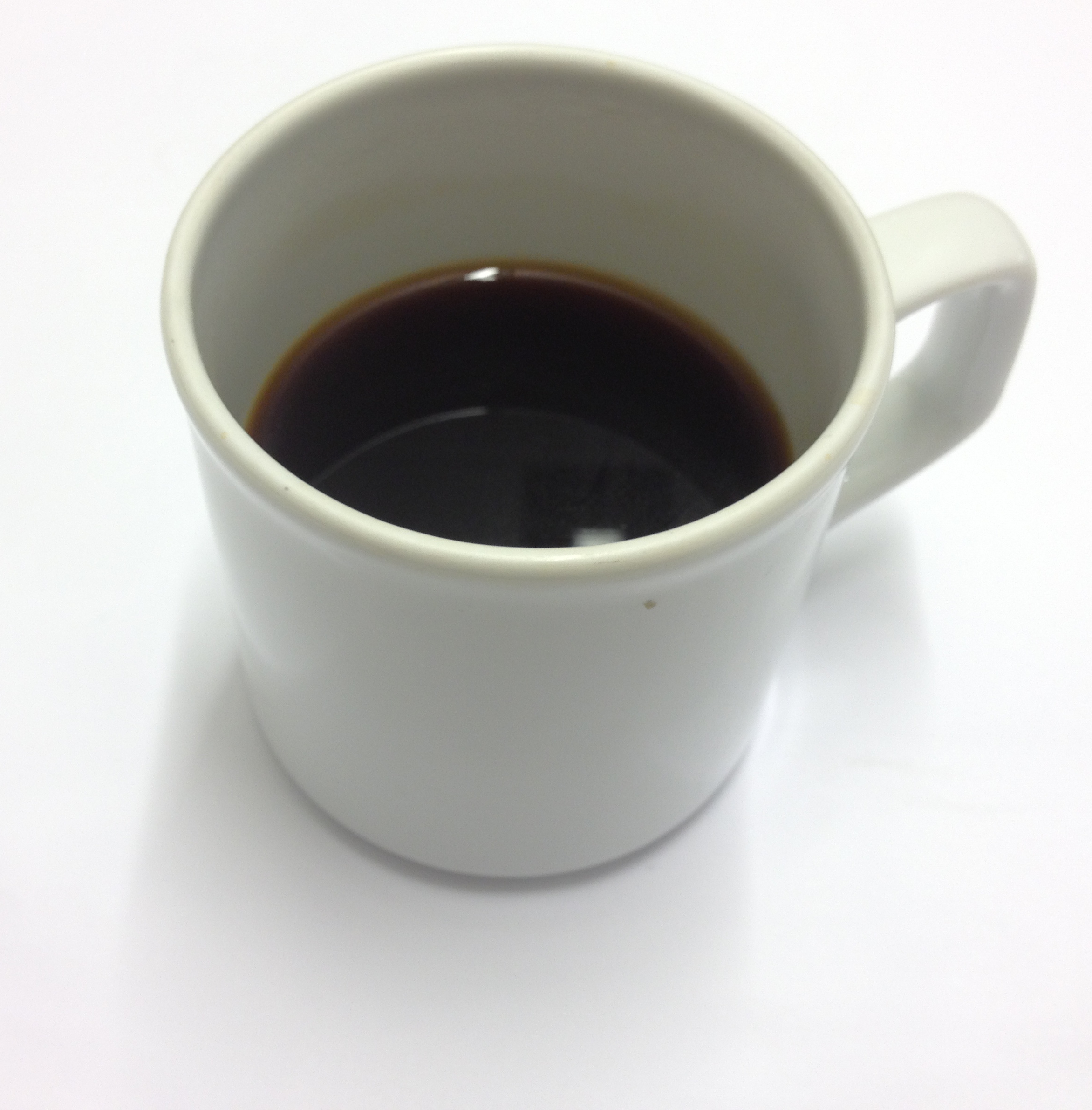 White_cup_of_black_coffee.jpg