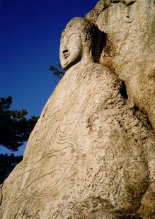 A stone image of a Buddha, near Gyeongju, South Korea. 7th century Silla. Korea south silla stone buddha.jpg