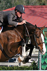 A rider with a modern style ASTM/SEI approved safety helmet with a decorative ventilation strip down the center. This popular style is sometimes informally known as a "skunk helmet". Hunterhorse.jpg