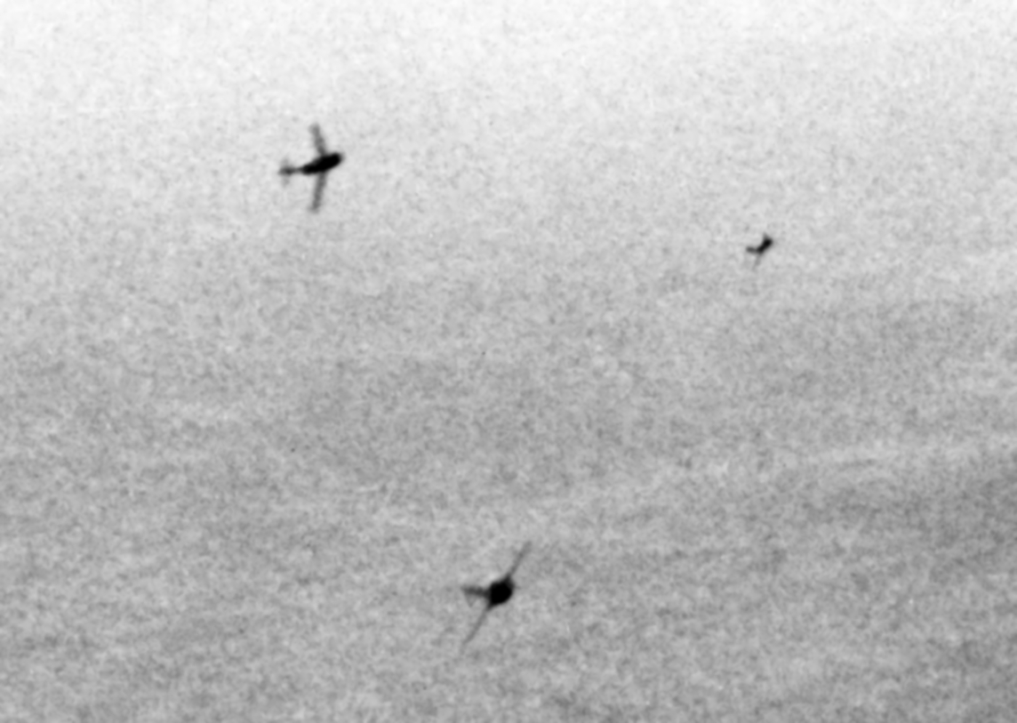 MiG-15s_curving_to_attack_B-29s_over_Kor