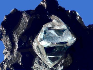 Nearly octahedral diamond crystal in matrix