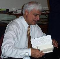 English: Ravi Zacharias signing books at the F...