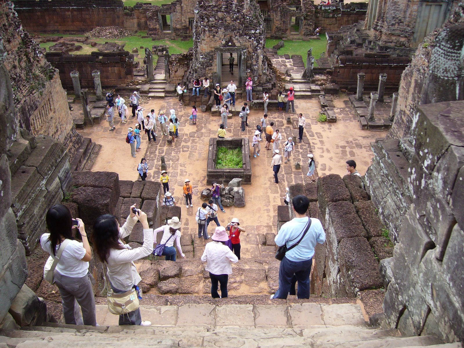 Tourists taking pictures at the khmer Pre Rup ...