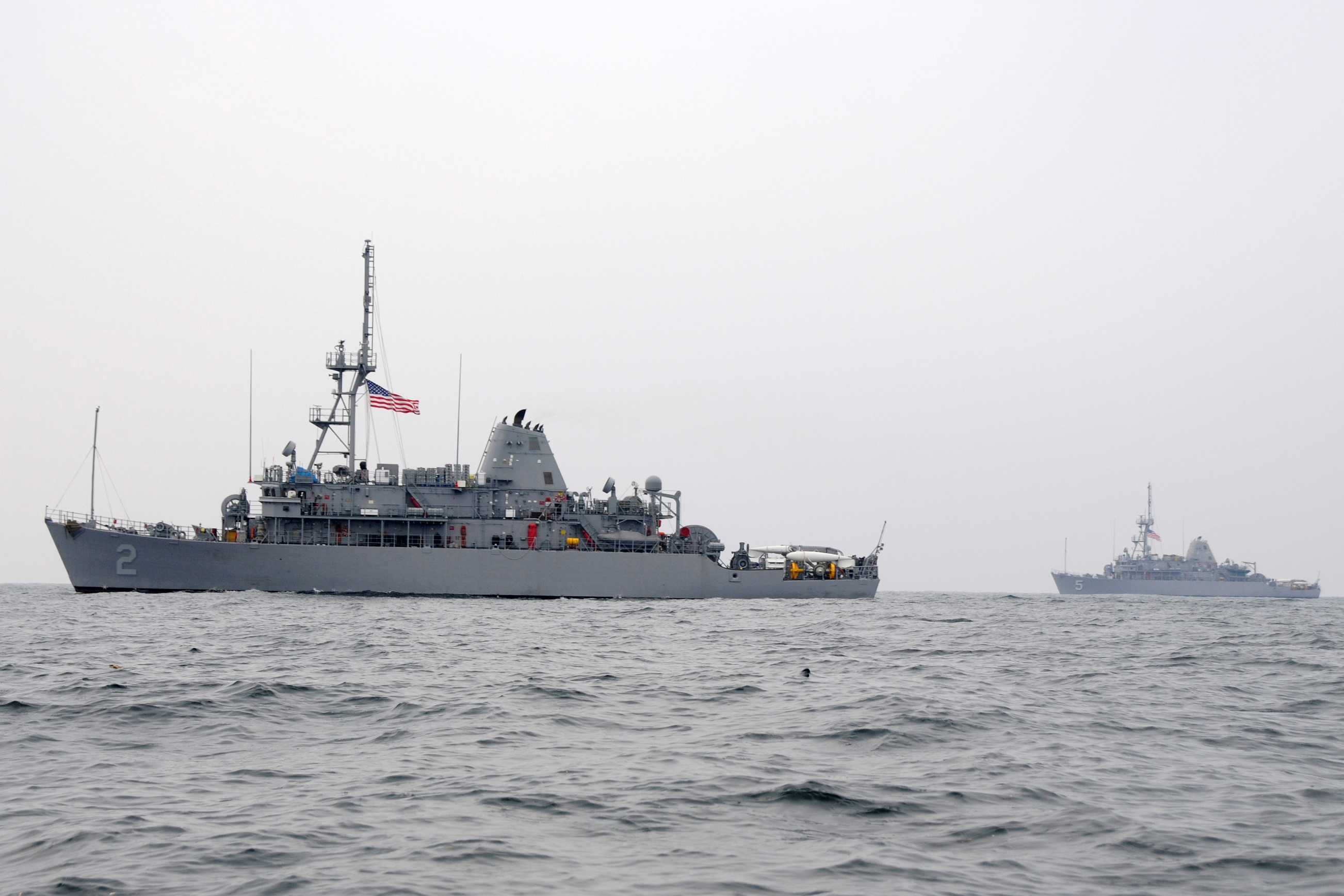 http://upload.wikimedia.org/wikipedia/commons/e/ef/US_Navy_091126-N-8335D-114_The_mine_countermeasures_ships_USS_Defender_(MCM_2)_and_USS_Guardian_(MCM_5)_are_underway_in_the_Yellow_Sea.jpg