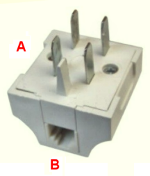 A photograph of a WT-4 plug with four metal prongs and a plastic pin protruding from the top, and an RJ-11 socket on the side. The metal prongs are labelled with the letter A, while the RJ-11 socket is labelled with the letter B.