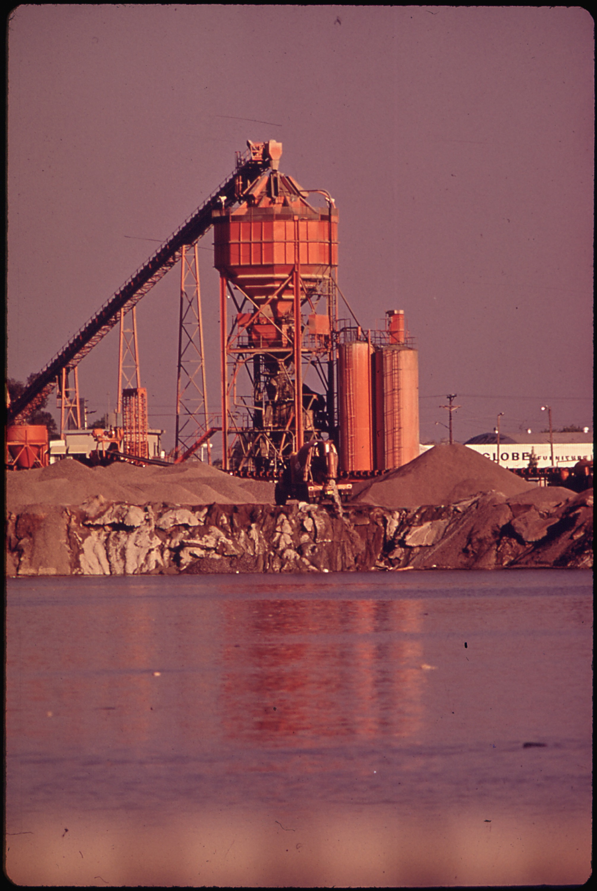 UNION ROCK AND MATERIAL PLANT. THE TRUCK IS DUMPING CONCRETE INTO THE SALT RIVER - NARA - 546752.jpg