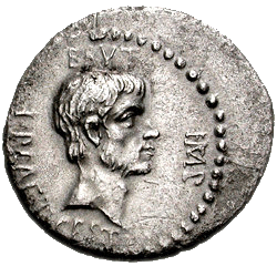 Grey coin with male face staring right