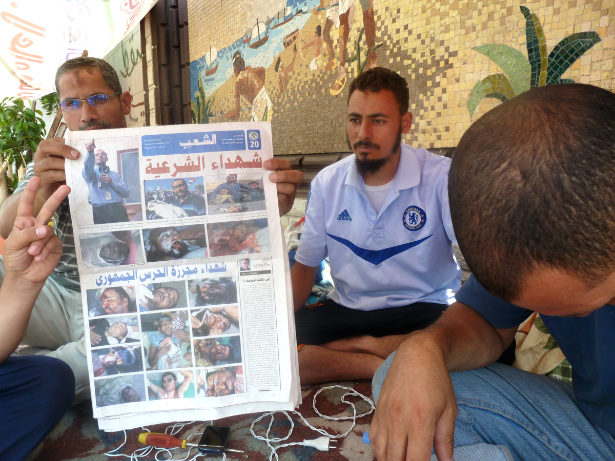 Muslim Brotherhood doctors showing photos of anti-coup protesters killed on July 8th 2013