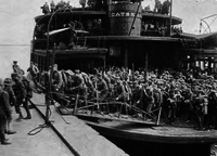 Troops from camps disembarking at Hoboken piers to board transports to Europe. Disembarking at Hoboken piers WW I.png