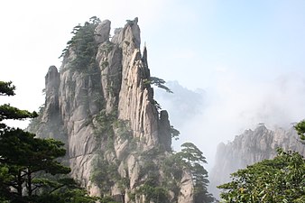 Huangshan with trees and clouds