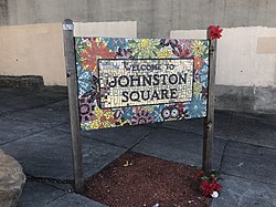 Johnston Square gateway sign at the corner of Greenmount Avenue and E. Biddle Street in Baltimore