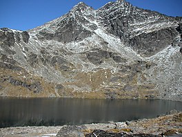 In late April 2007, the snow is minimal. In winter it is frozen solid. the double cone peaks of The Remarkables are in the background.