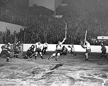Red Wings and Maple Leaf game during the 1942 Stanley Cup Finals, with Maple Leafs players celebrating moments after scoring a goal.