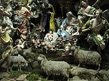 Typical Neapolitan nativity scene, or presepe
or presepio
, in Naples. Local creches are renowned for their ornate decorations and symbolic figurines, often mirroring daily life. Manifattura napoletana, nativita con gloria d'angeli, 1750-1800 ca., OA8516-8559, 02.JPG