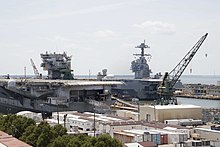 The decommissioned Enterprise alongside her replacement, USS Gerald R. Ford, at Newport News, July 2018 USS Enterprise (CVN-65) at Newport News Shipbuilding on 15 July 2018 (180715-N-AO748-0061).JPG