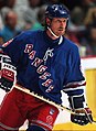 Image 13 Wayne Gretzky Photo credit: Håkan Dahlström Ice hockey player Wayne Gretzky, as a member of the New York Rangers of the National Hockey League (NHL) in 1997. Gretzky, nicknamed "The Great One", is widely considered the best hockey player of all time. Upon his retirement in 1999, he held forty regular-season records, fifteen playoff records, and six All-Star records. He is the only NHL player to total over 200 points in one season—a feat he accomplished four times. In addition, he tallied over 100 points in 15 NHL seasons, 13 of them consecutively. He is the only player to have his number (99) officially retired by the NHL for all teams. More selected portraits