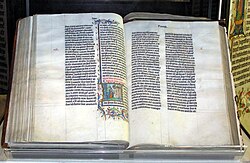 A Bible handwritten in Latin, on display in Malmesbury Abbey, Wiltshire, England. This Bible was transcribed in Belgium in 1407, for reading aloud in a monastery.