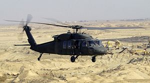 UH-60L Blackhawk helicopter flies a low-level ...