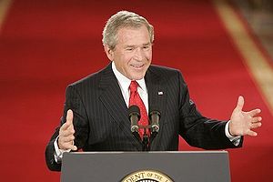 George W. Bush speaking at podium during press conference