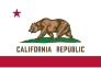 The state flag of California: a grizzly bear facing left, walking upon a grass plat, centered in a field of white above the words CALIFORNIA REPUBLIC, with a red stripe below and a single red star above near the hoist