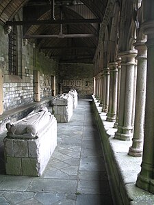 A row of gisants in the west aisle of the cathedral cloisters