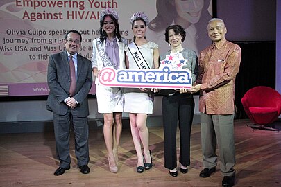 Herman (two from the left) with Miss Universe 2012, Olivia Culpo promoting HIV AIDS awareness in Embassy of the United States, Jakarta on 5 February 2013.