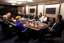 President Barack Obama at an NSC meeting in the Situation Room. Participants include Secretary of State Hillary Clinton, Defense Secretary Robert Gates, NSC Advisor Gen. James "Jim" Jones, Director of National Intelligence (DNI) Dennis Blair, Deputy National Security Advisor Tom Donilon, White House Counsel Greg Craig, CIA Director Leon Panetta, Vice Chairman of the Joint Chiefs of Staff Gen. James Cartwright, and White House Chief of Staff Rahm Emanuel NationalSecurityCouncilMeeting.jpg