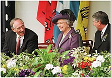 The official reconvening of the Scottish Parliament in July 1999 with Donald Dewar, then first minister of Scotland (left) with Queen Elizabeth II (centre) Opening of the Scottish Parliament, 1999.jpg