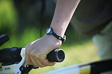 A Power Balance wrist band PB band on biker.jpg