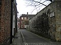 The wall forms the northern side of most of Precentor's Court