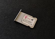 T-Mobile nano-SIM card with NFC capabilities in the SIM tray of an iPhone 6s Simkarte NFC SecureElement.jpg