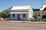 The building with its corrugated iron roof and verandah is a typical example of a pioneers house. This building, which was erected in 1897, is a typical example of a pioneer house. It is one of the oldest buildings in Kenhardt and is of great historical importance to the area. The building was used as a library until 1977 and is one of the most Type of site: Library Previous use: Residential : Single. Current use: Institutional - Museum. This building, which was erected in 1897, is a typical example of a pioneer house. It is one of the oldest buildings in Kenhardt and is of great historical importance to the area.