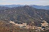 笠置山から望む二ッ森山と遠景の阿寺山地、山麓に棚田（2017年3月4日撮影）