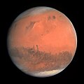 Image 11 Mars Photograph cr: European Space Agency Mars is the fourth planet from the Sun and is known as the "Red Planet" due to its reddish appearance as seen from Earth. The planet is named after Mars, the Roman god of war. A terrestrial planet, Mars has a thin atmosphere and surface features reminiscent both of the impact craters of the Moon and the volcanoes, valleys, deserts and polar ice caps of the Earth. The planet has the highest mountain in the Solar System, Olympus Mons, as well as the largest canyon, Valles Marineris. Mars's rotation period and seasonal cycles are also similar to those of the Earth. Of all the planets in the Solar System other than Earth, Mars is the most likely to harbour liquid water and perhaps life. There are ongoing investigations assessing Mars's past potential for habitability, as well as the possibility of extant life. Future astrobiology missions are planned, including NASA's Mars 2020 rover and the European Space Agency (ESA)'s Rosalind Franklin rover. In November 2016, NASA reported finding a large amount of underground ice in the Utopia Planitia region of the planet. The volume of water detected has been estimated to be equivalent to the volume of water in Lake Superior. Mars has two moons, Phobos and Deimos, which are small and irregularly shaped. This picture is a true-colour image of Mars, taken from a distance of about 240,000 kilometres (150,000 mi) by the OSIRIS instrument on ESA's Rosetta spacecraft, during its February 2007 flyby of the planet. The image was generated using OSIRIS's orange (red), green and blue filters. More selected pictures