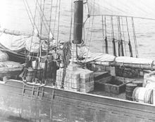 Rum runner schooner Kirk and Sweeney with contraband stacked on deck Rumrunner cargo.jpg