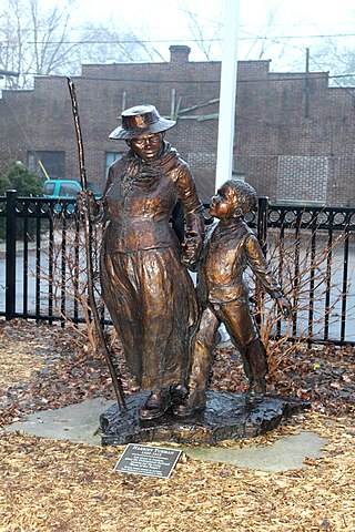 Statue commemorating Harriet Tubman, Ypsilanti District Library, 229 West Michigan Avenue,Ypsilanti, Michigan. The sculptor is Jane DeDecker. The sculpture was installed in 2006 according to the plaque at the foot of the sculpture.