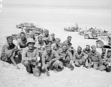 New Zealand members of the Long Range Desert Group pause for tea in the Western Desert, 27 March 1941 The British Army in North Africa 1941 E2307.2.jpg