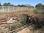 Langlaagte lies about eleven kilometres from the centre of Johannesburg. In a memorial park adjoining the Main Reef Road one may still see the excavations on the claims of the discoverers of the Main Reef Group of Conglomerates of the Witwatersrand.