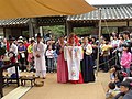 A good candidate is this picture of a traditional Korean wedding, although I'm not sure if clearly showing faces is allowed?