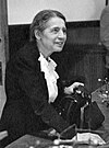 Lise Meitner Lise Meitner (1878-1968), lecturing at Catholic University, Washington, D.C., 1946.jpg