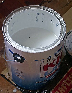 Kilz brand White primer in a bucket, shot whil...