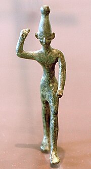 Ba'al with raised arm, 14th-12th century BC, found at Ras Shamra (ancient Ugarit), Louvre Baal Ugarit Louvre AO17329.jpg