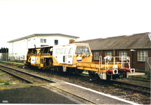 A Carillion Rail ballast/track tamper train at Banbury railway station Banbury Carrilion train 1.png