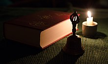 In some cases, excommunication would be announced with a ceremony involving a bell, book, and candle. Bell, book and candle 2014.jpg