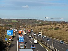 Transport emits the most greenhouse gas. Crossing the M25 by footpath - geograph.org.uk - 626651.jpg