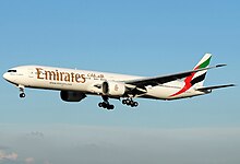 A Boeing 777-300ER of Dubai-based Emirates, one of the two flag carriers of the United Arab Emirates Emirates B777-300ER (A6-ECU) @ FCO, July 2011.jpg