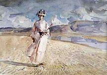 砂浜を歩く女性(c.1910)
