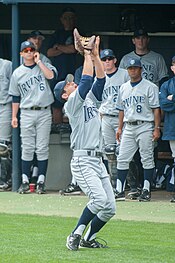 An Anteaters baseball player settles under a popup as teammates look on during a 2010 game in Los Angeles Jordan Fox (21361588728).jpg